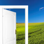 A door opening in a field