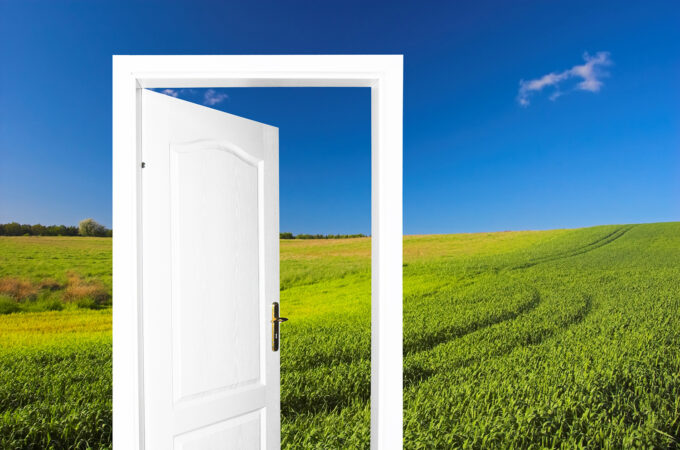 A door opening in a field