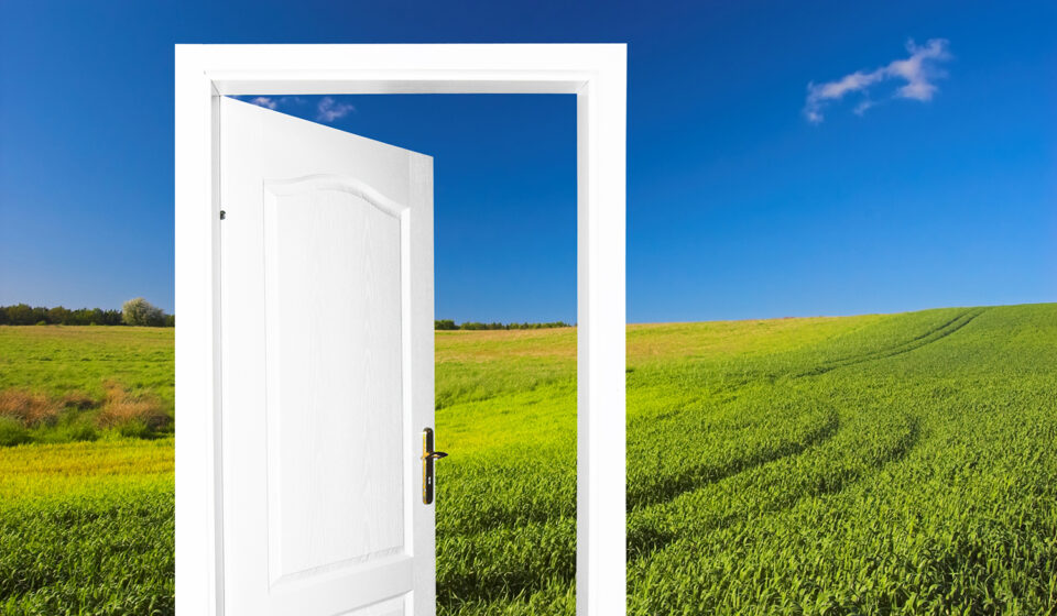 A door opening in a field